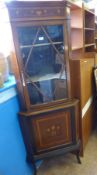 An Art Nouveau Mahogany Corner Display Cabinet, with glazed door and cupboard beneath. Decorative