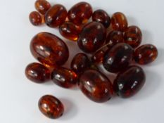 Nineteen Loose Amber Beads, approx 60 gms, largest bead 3 x 2 cms