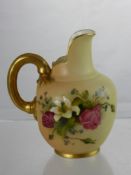 A Royal Worcester Blush Ware Jug, having a gilded handle, hand painted with a floral spray, nr