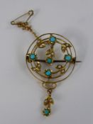 An Edwardian 9 ct Gold seed pearl and turquoise brooch.