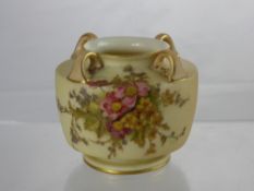A Royal Worcester Blush Ware Vase, the four handled vase hand painted with a floral spray, nr 991 to