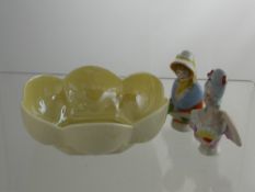 Two Victorian Porcelain Pin Cushions,  together with a Belleek scallop form trinket dish. (3)