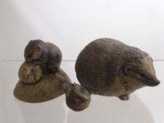 Three Ceramic Poole Pottery Figurines, including a Hedgehog, Doormouse and a Wren. (3)