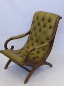 A Late Victorian Slipper Chair with leather upholstery.