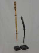 Two Tribal Hair Pins, one made of buffalo horn and the other whale bone. (2)