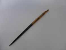 An Indonesian Bone and Wood Ceremonial Staff, approx 66 cms.