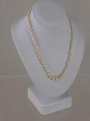 A Set of Graduated Antique Cultured Pearls together with a pair of earrings.