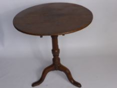 An Antique Oak Kitchen Table, turned column on splayed feet.