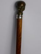 A Rosewood Shafted Walking Cane, with bronze 