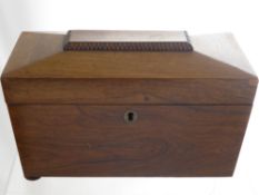 A Georgian Mahogany Tea Caddy in the form of a casket on bun feet, together with a mahogany