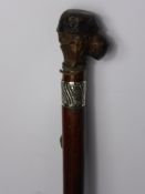 An Unusual Walking Cane, with knop carved as a grotesque face with inset glass eyes with silver