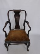 An Antique Mahogany Georgian Armchair, the armchair on cabriole feet with stretchers.