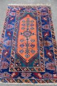 An Antique Woollen Shiraz Carpet, having central ghoul cartouche with tribal stylised border, approx