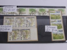 Two Blue Crates of All-World Stamps, in album and on cover.