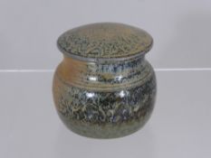 A Winchcombe Pottery Cylindrical Tobacco Jar, approx 12 cms high.