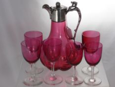 An Antique Continental Cranbury Glass Claret Jug, the melon form segmented jug having a dragon