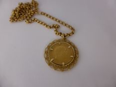 An Edward VII 1902 Full Sovereign, in 9 ct gold mount on 9 ct gold chain (9 ct approx 8 gms).
