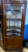 An Antique Glazed Front Mahogany Corner Cabinet.