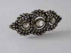 An Antique Silver and 9 ct Gold Lady's Rose Cut Diamond Brooch, having three central diamonds set