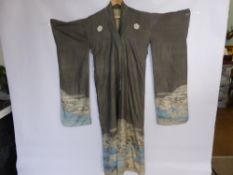 A Vintage Silk Japanese Kimono, the kimono depicting mountain scenes.