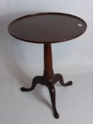 A Reproduction Mahogany Tilt Top Table on hoof feet, approx 60 x 71 cms.