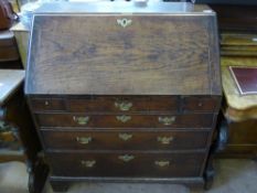 A Georgian Oak Drop Front Bureau, fitted interior with three graduated drawers, approx 90 x 62 x 102