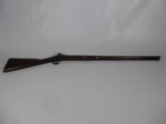 An English 12 Bore Back Action Single Barrel Percussion Shotgun by Jones.