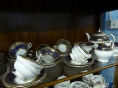 A Part Royal Worcester Model No. W9424, the blue floral gilded set comprising tea pot, 2 x sugar