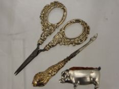 A Silver Metal Pin Cushion in the form of a pig, together with a silver handled needlework