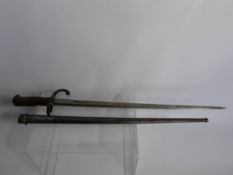 A French First World War Bayonet in Scabbard, the blade engraved The Mtre d' Armes de Tulle Juin