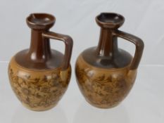 A Pair of Doulton Stone Ware Miniature Jugs, two tone brown with foliate design. (2)
