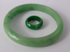 An Apple Green Jade Bracelet together with a bright green jade ring, bangle 70 mm, ring 20 mm.