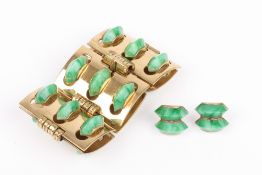 A costume jewellery gilt metal bracelet and earrings, inset with green bakelite half roundels . Good