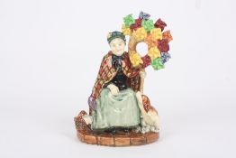 A Royal Doulton porcelain figure ‘The Windmills Lady’, HN1400, designed by Leslie Harradine, dated