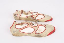 A pair of ladies 1920s rubber Silver Wing shoes, the cream shoes with red outline to cut-outs,