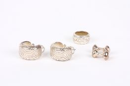 A pair of silver coloured metal Tiffany barrel shaped earrings and matching ring, with abstract