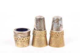 A Stuart Devlin silver and silver gilt three piece cruet set, hallmarked London 1975, of tapering