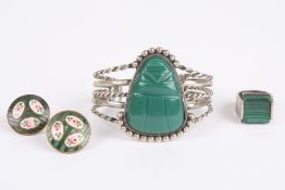 A Mexican white metal bangle, with central Mexican figurehead the bangle marked Sterling, with white