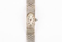 A ladies 9ct white gold Milner wrist watch, with bark effect strap and jewelled winder, the clasp