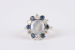 An Art Deco Sapphire and diamond cluster ringset with central pale blue sapphire surrounded by
