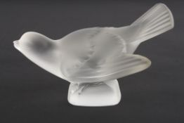 A Lalique frosted glass birdin crouching pose with wings outswept. Etched signature to base '