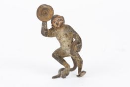 An early 20th century Austrian cold painted bronze monkeystood in a dancing pose holding cymbals,