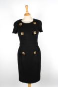 Two Chanel dressesthe first wool black dress with short sleeves, and six gilt beaded buttons to