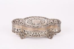 A George V pierced silver jewellery caskethallmarked 1922, of lozenge shape the lid with vacant