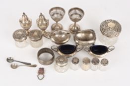 A collection of silvercomprising predominantly tableware including pepperettes, salts, mustard pot,