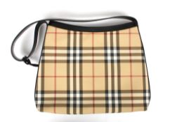 A ladies handbag by Burberrythe slightly tapered bag with leather strap, in traditional black brown