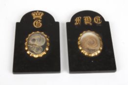 A pair of 19th century memorial plaquesformed as small black marble headstones, each crested with