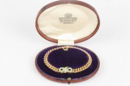 A Victorian 15ct gold and turquoise curblink braceletby Mappin & Webb, with central bow set with