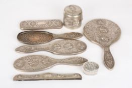 An early 20th century Persian white metal box and covertogether with a white metal Persian dressing