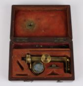 A 19th century simple brass microscopecontained within a fitted mahogany case together with a
